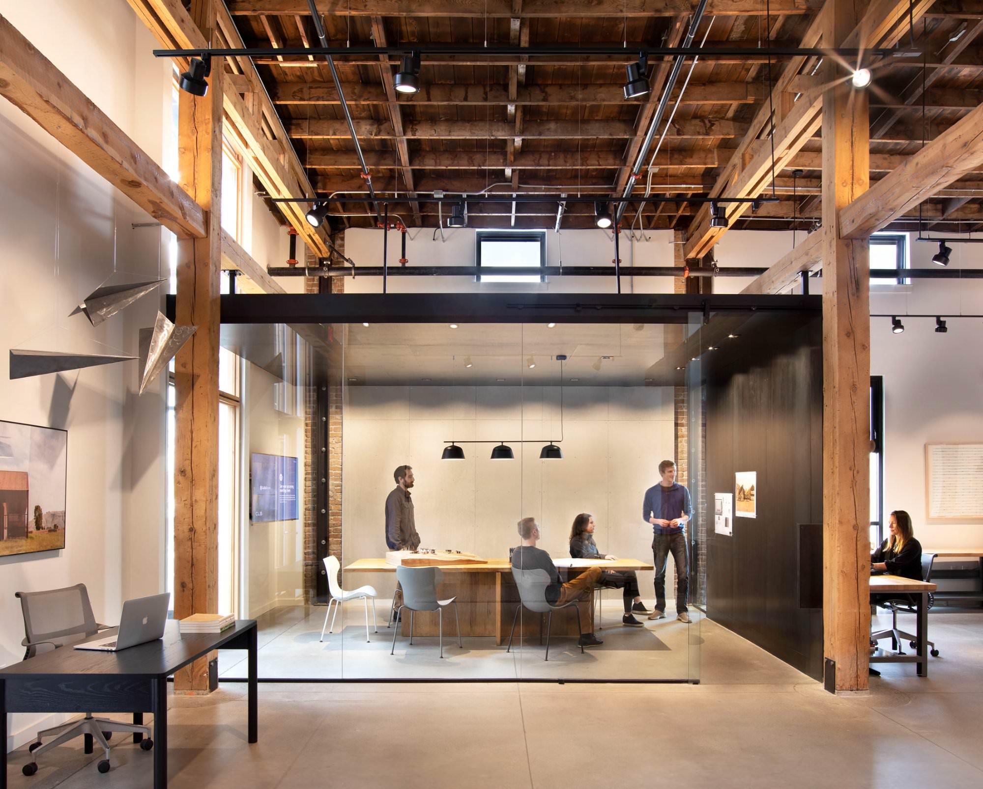 CLB Architects Bozeman — glazed conference room with painting seen through glass