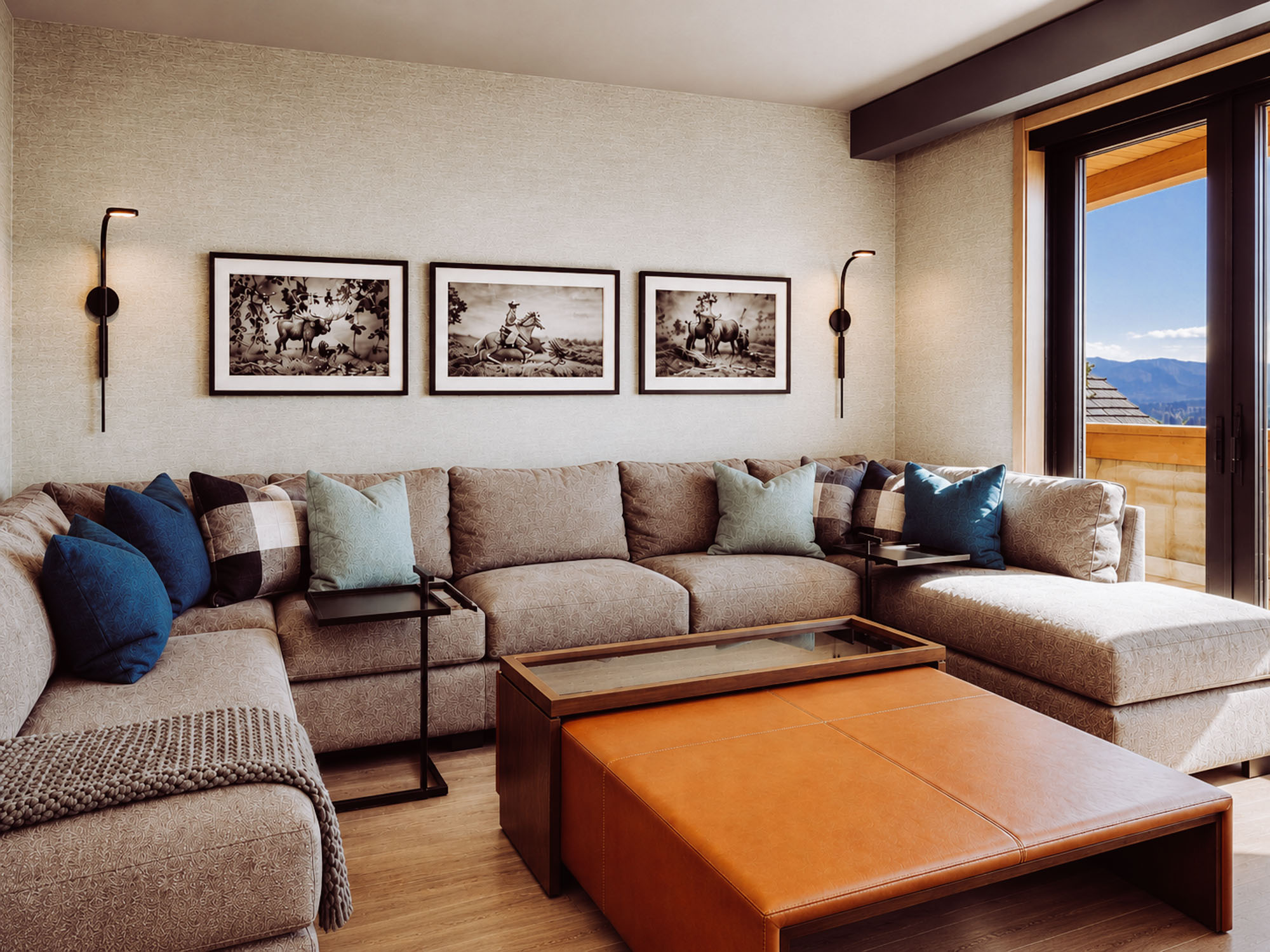 Montage Spanish Peaks residence — sunlit lounge with sepia triptych
